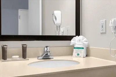a bathroom sink with a blow dryer on it at Studio Apartment w Pool & Hot Tub - Near Universal Studio in Orlando