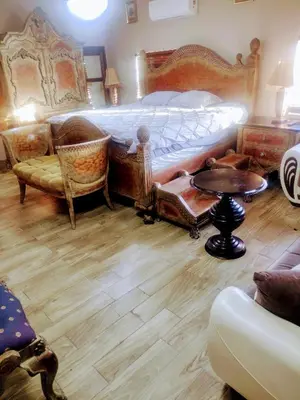 a bedroom with a bed and a table and chairs at A peaceful living vibe in Orlando