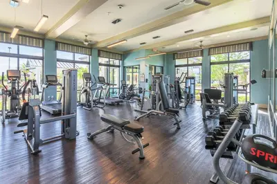 a gym with several treadmills and cardio machines at Chic 1-Bedroom Apt in Lake Nona in Orlando