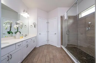 a bathroom with a shower and a sink at Luxury Lakeview Home Private Pool 2687 in Kissimmee