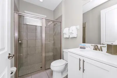 a bathroom with a shower and a toilet and a sink at Marvelous Home With Private Pool And Waterpark & Resort Access Near Disney At Encore Resorts Reunion - 7464Mr in Kissimmee