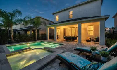 a swimming pool in front of a house at Luxury Private Villa with Large Pool on Encore Resort at Reunion Orlando Villa 4433 in Orlando