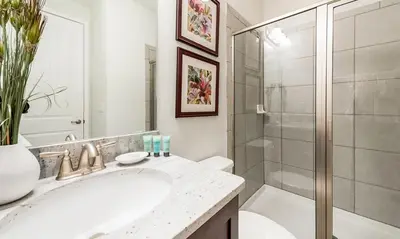 a bathroom with a sink and a shower at 5 Star Villa on Orlando’s most Exclusive Encore Resort at Reunion Orlando Villa 4377 in Orlando