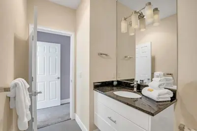 a bathroom with a sink and a mirror at Modern Townhome with 3 Bedrooms 5506 in Orlando