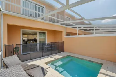 a swimming pool on the balcony of a house at Modern Townhome with 3 Bedrooms 5506 in Orlando