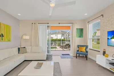 a living room with a couch and a table at Modern Townhome with 3 Bedrooms 5506 in Orlando