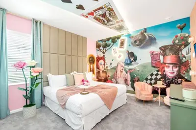 a bedroom with a bed and a painting on the wall at Amazing Mansion on Veranda Palms Resort with the Best 5 Star Amenities Orlando Mansion 5533 in Kissimmee