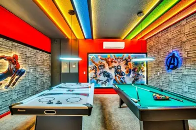 a room with a pool table and colorful lights at Amazing Mansion on Veranda Palms Resort with the Best 5 Star Amenities Orlando Mansion 5533 in Kissimmee