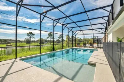 an indoor swimming pool with a glass roof at Amazing Mansion on Veranda Palms Resort with the Best 5 Star Amenities Orlando Mansion 5533 in Kissimmee