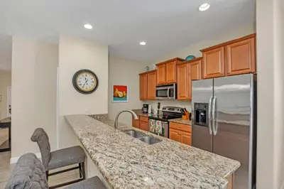 a kitchen with a sink and a counter top at Luxury 5 Star Villa on Paradise Palms ResortMinutes from Disney World Orlando Townhome 5502 in Kissimmee