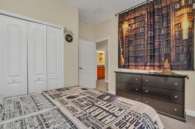 a bedroom with a bed and a dresser at Luxury 5 Star Villa on Paradise Palms ResortMinutes from Disney World Orlando Townhome 5502 in Kissimmee