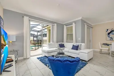a living room with a couch and a table at Imagine You and Your Family Renting this 5 Star Villa on Storey Lake Resort Orlando Townhome 5519 in Kissimmee