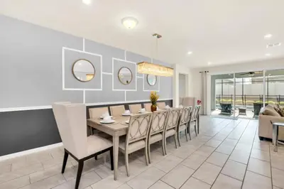 a dining room with a table and chairs at Elegant Villa for Large Groups 6281 in Kissimmee