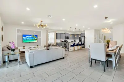 a living room with a couch and a table at Elegant Villa for Large Groups 6281 in Kissimmee