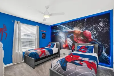 a bedroom with two beds and a spider man mural at Elegant Villa for Large Groups 6281 in Kissimmee