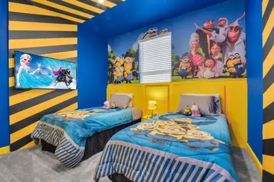 two beds in a room with blue and yellow walls at Private Oasis: 6 Bedroom Villa Retreat 6327 in Kissimmee