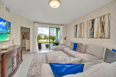 a living room with couches and blue pillows at Chic Urban Oasis with 3 Bedrooms 6333 in Kissimmee