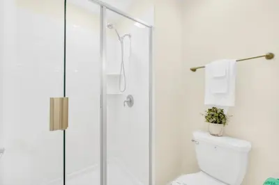a white bathroom with a shower and a toilet at Your Ultimate Vacation Getaway 6336 in Kissimmee