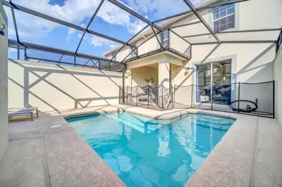 a swimming pool in a house with a glass ceiling at Your Ultimate Vacation Getaway 6336 in Kissimmee