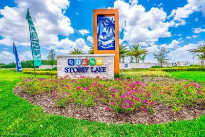 a sign for a showy lake with flowers at Your Ultimate Vacation Getaway 6336 in Kissimmee