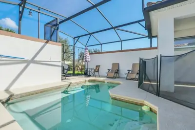a swimming pool in a house with a glass ceiling at Spacious 5 Bedroom Villa for Families 6337 in Kissimmee