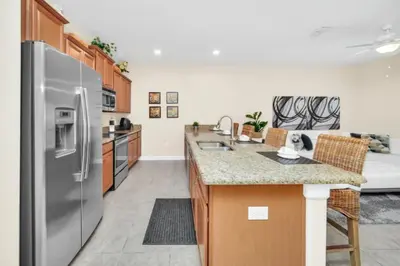 a kitchen with a stainless steel refrigerator at Tranquil Villa Retreat with Mountain Views 6338 in Kissimmee