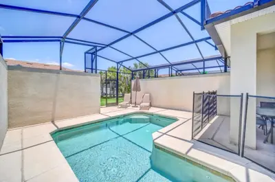 a swimming pool in the backyard of a house at Tranquil Villa Retreat with Mountain Views 6338 in Kissimmee