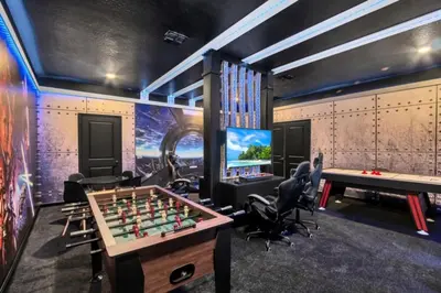 a game room with a chessboard and a television at Spacious Villa Retreat with 9 Bedrooms 6381 in Kissimmee