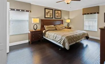 a bedroom with a bed and a ceiling fan at Beautiful House with first class amenities on Paradise Palms Resort Orlando House 6298 in Kissimmee