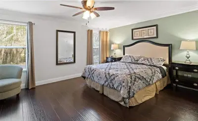 a bedroom with a bed and a ceiling fan at Beautiful House with first class amenities on Paradise Palms Resort Orlando House 6298 in Kissimmee