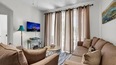 a living room with a couch and a table at Orlando Condo 6420: Family-Friendly Resort Near Disney in Kissimmee