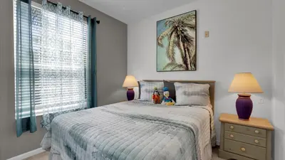a bedroom with a bed with two stuffed animals on it at Orlando Condo 6420: Family-Friendly Resort Near Disney in Kissimmee