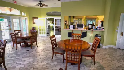 a dining room with a table and chairs at 5-Star Orlando Townhome 6423 - Resort Amenities Near Disney in Kissimmee