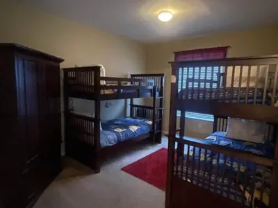 a room with three bunk beds in a room at Orlando Condo 6428: Your 5-Star Family Getaway in Orlando