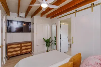 a bedroom with a bed and a ceiling fan at Orlando Home 6430: Purpose-Driven A-Frame Vacation Home in Clermont