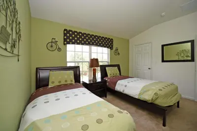 a bedroom with two beds and a window at Orlando Townhome 6436: Family Fun Near Disney World in Orlando