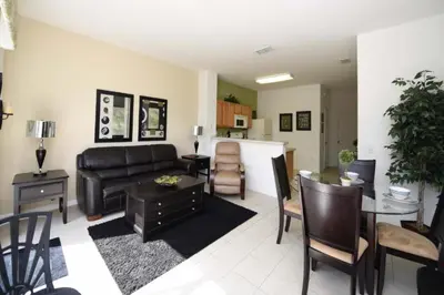 a living room with a couch and a table at Orlando Townhome 6436: Family Fun Near Disney World in Orlando
