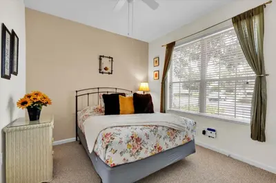 a bedroom with a bed and a window at Orlando Townhome 6442 - Private Pool Club Access in Orlando