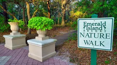 a sign that says emerald island resort and nature walk at Stay Near Disney at Orlando Townhome 6444 Sleeps 8 in Kissimmee