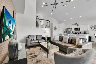 a living room with a couch and a table at Orlando Villa 6469: 6BR Home Near Disney Parks in Kissimmee