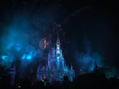 a disney castle with fireworks at night at Picture Renting Your Own Luxury Villa on the Exclusive Paradiso Grande Resort close to Disney Orlando Villa 6402 in Orlando