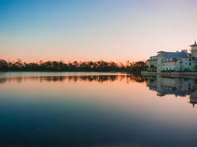 a large body of water with houses and buildings at Imagine Your Family Renting This Luxury Contemporary Style Villa on Paradiso Grande Resor Orlando Villa 6403 in Orlando