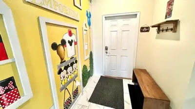 a hallway with a door with a penguin wall at Orlando Villa 6227: The Secret to Your Dream Resort Holiday in Kissimmee