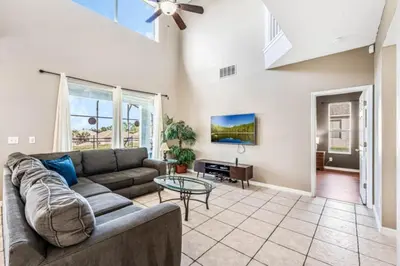 a living room with a couch and a table at Orlando Villa 6245: Dream Holiday Villa in Emerald Island in Kissimmee