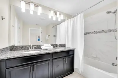 a bathroom with a sink and a shower at Orlando Villa 6247: Relax in Style at Storey Lake Resort in Kissimmee