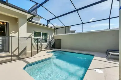 a swimming pool in a house with a glass ceiling at Luxury Villa at Storey Lake Resort Near Disney – Orlando Villa 6253 in Kissimmee