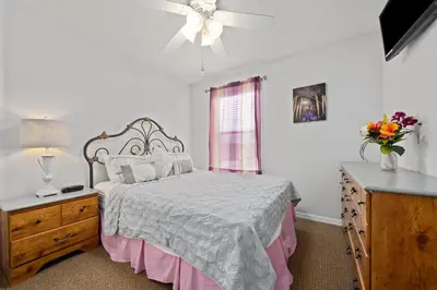 a bedroom with a bed and a dresser and a window at Luxury Villa with private Pool Emerald Island Resort Orlando Villa 5074 in Kissimmee