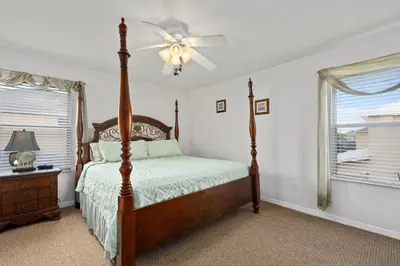 a bedroom with a bed and a ceiling fan at Luxury Villa with private Pool Emerald Island Resort Orlando Villa 5074 in Kissimmee