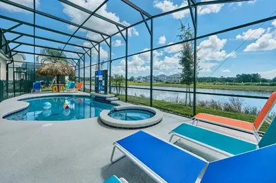 a swimming pool in a glass house with a view at 5 Star Mansion with Private Pool on Veranda Palms Orlando Mansion 5377 in Kissimmee