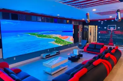 a living room with a large flat screen tv at Perfect Mansion on Veranda Palms Orlando Mansion 5379 in Kissimmee